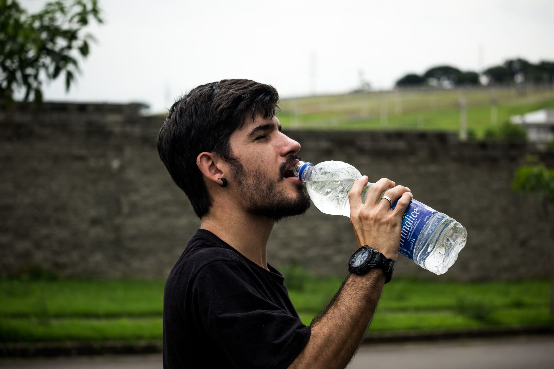 Person drinking a glass of water