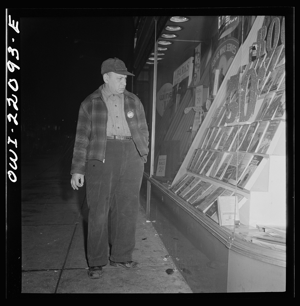 A night shift worker waiting for her ride, 1943