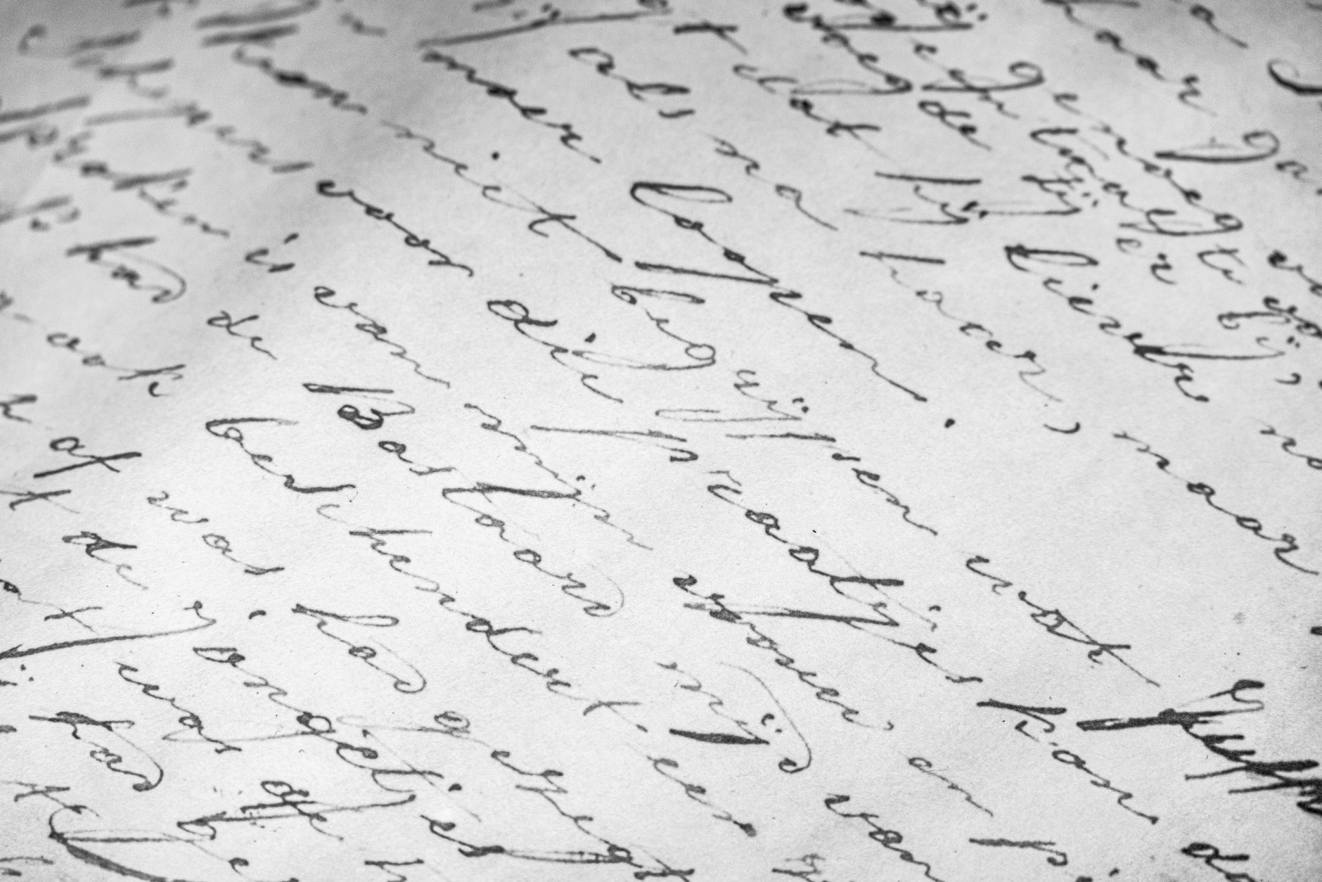 Close-up of vintage cursive handwriting in ink on aged paper